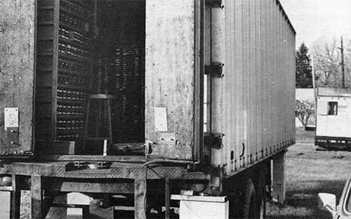 Photograph of the inside of a tractor trailer full of matrices